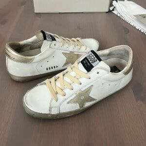 Golden Goose Women’s Superstar with Gold Sparkle Foxing and Metal Stud Lettering